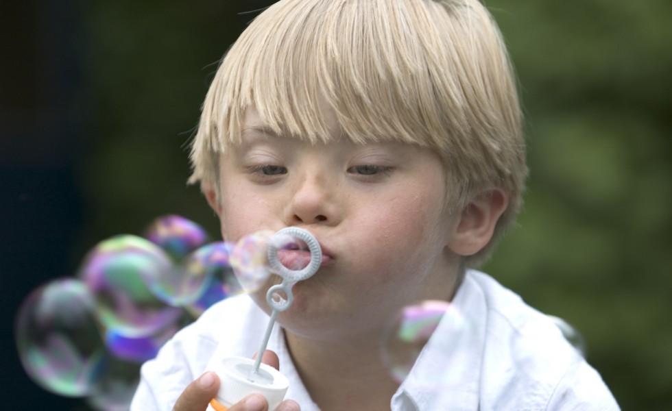 Boy blowing bubbles